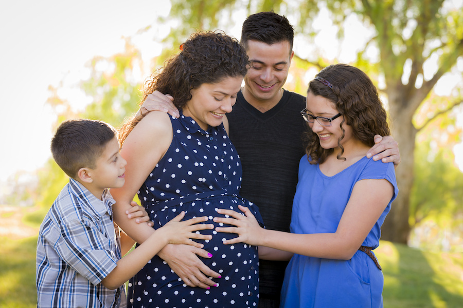 pregnant woman and family