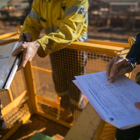 Close up image of builders and their building documents
